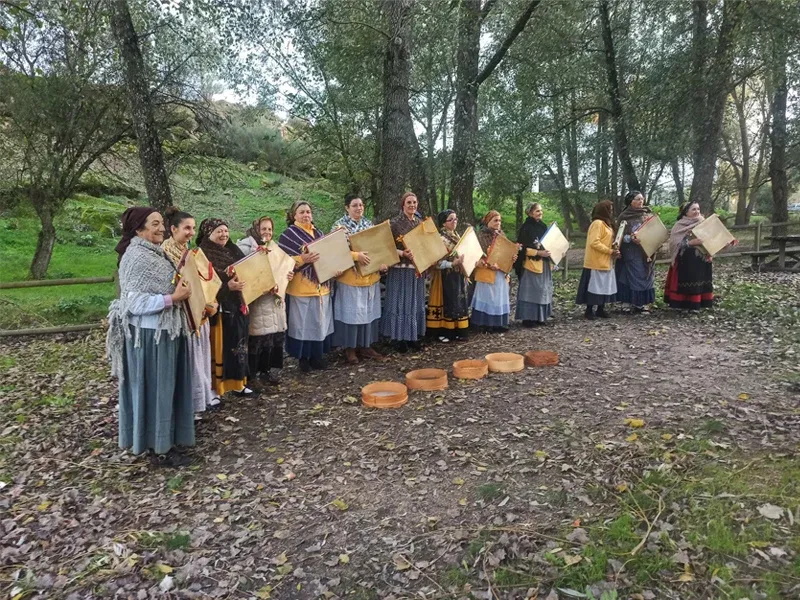 Ladies playing a local music instrument, Adufe, in the center of Portugal